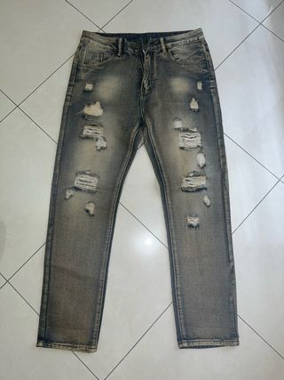 Jeans strappati uomo