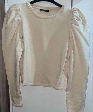 Sudadera beige con mangas abullonadas