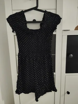 Peto negro con lunares blancos