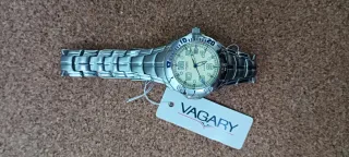 Reloj Vagary Plata y Beige