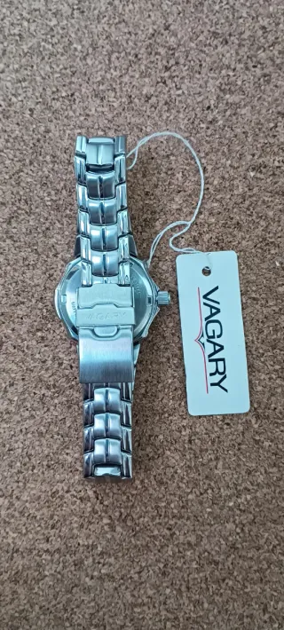 Reloj Vagary Plata y Beige