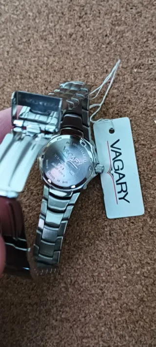 Reloj Vagary Plata y Beige