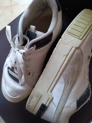 Zapatillas Puma grises y blancas