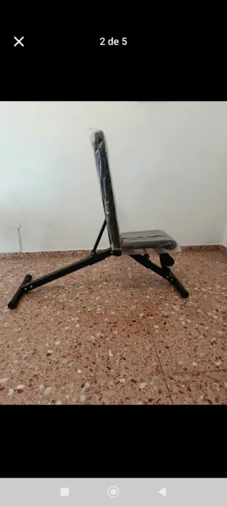 Banco de musculación con discos