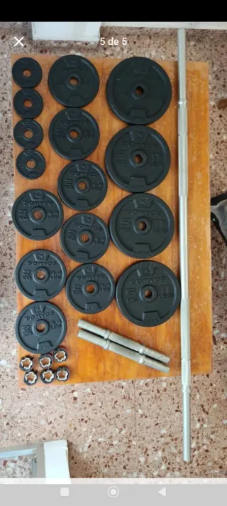 Banco de musculación con discos