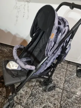 Silla de paseo marca Tuc Tuc con saco y mochila