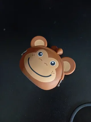 Monedero mono plástico