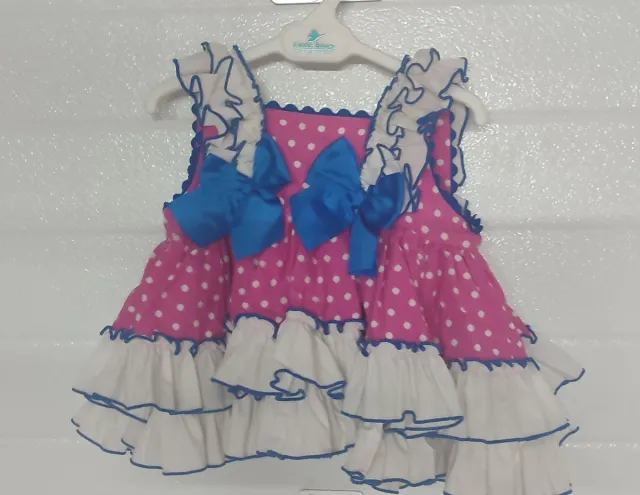 Vestido bebé rosa lunares volantes
