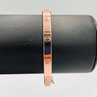 PULSERA RIGIDA TORNILLO ORO ROSA. Hueca. Oro 18k.