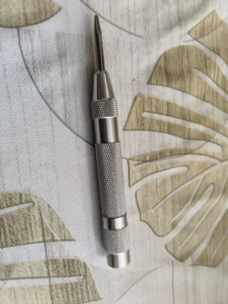 Punzón central automático metálico