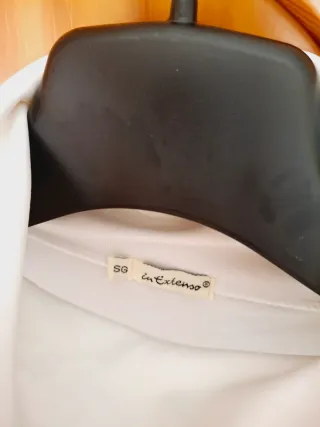 Jersey cuello alto sin mangas blanco