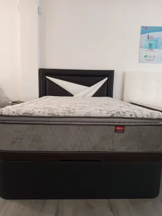 Canapé de tela y polipiel negro y blanco