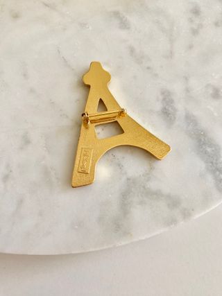 Broche Torre Eiffel Yves Saint Laurent Dorado