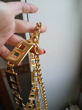 Cintura vintage dorata con pendente