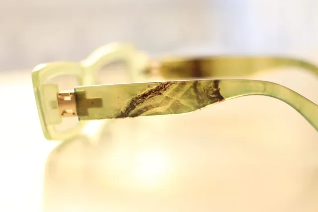 Gafas de sol Mujer verdes y doradas.