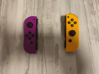 Mando Nintendo Switch Morado y Amarillo sólo envío