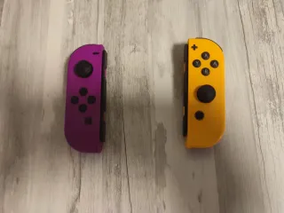 Mando Nintendo Switch Morado y Amarillo sólo envío