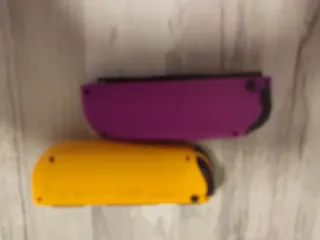 Mando Nintendo Switch Morado y Amarillo sólo envío