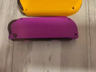Mando Nintendo Switch Morado y Amarillo sólo envío