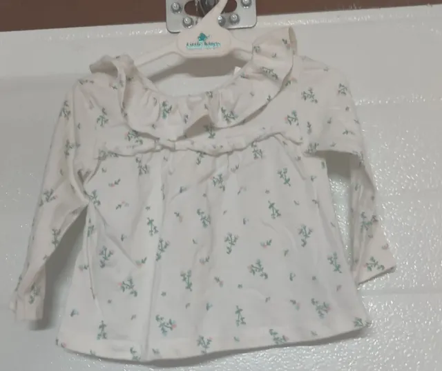 Blusa de manga larga con flores rosas