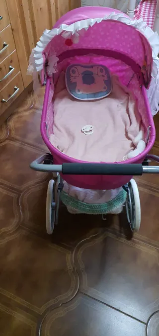 Cochecito de muñecas rosa