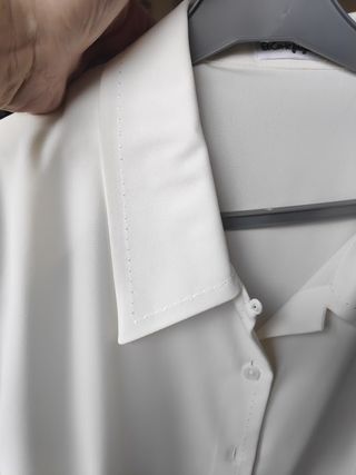 Blusa de manga larga color marfil. El corte Inglés