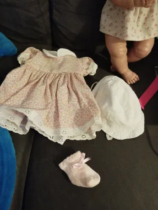 Muñeca bebé con hamaca y accesorios