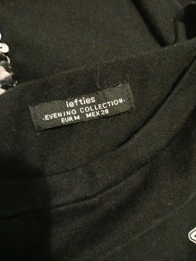 Camisa con lentejuelas negra y dorada