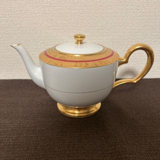 Tetera de porcelana dorada