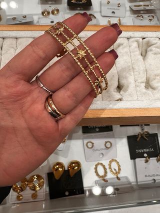 Bracciale rigido in acciaio dorato