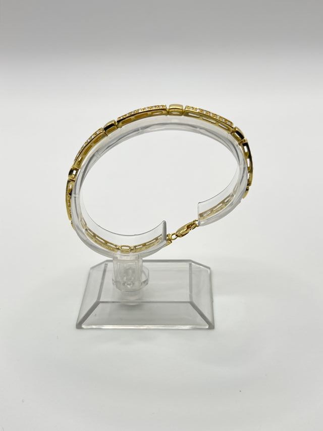 Bracciale in oro 18k con ciondoli di zirconi Peso: 10 gr.