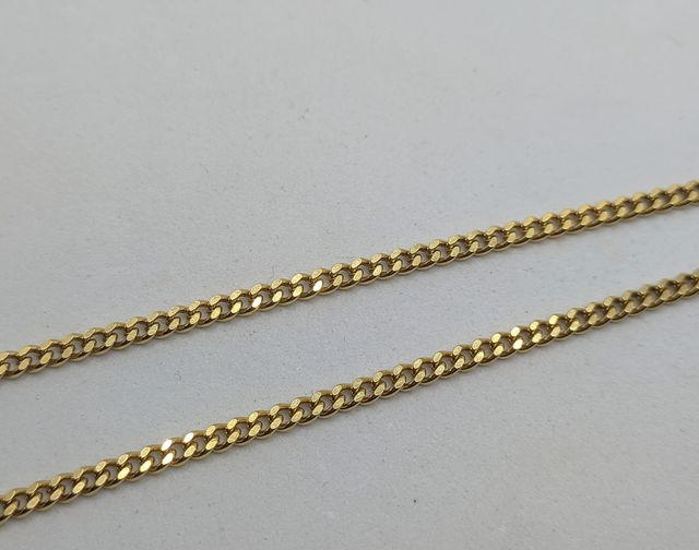 Cadena Barbada de oro de 18k, 17.33 g, 61 cm.