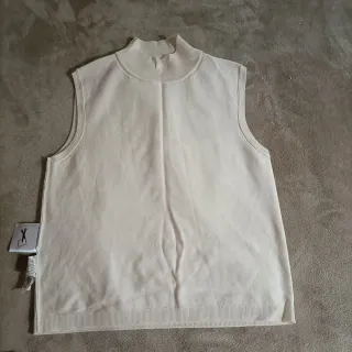 Chaleco de punto beige sin mangas