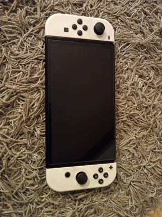 Nintendo Switch (modello OLED) Bianca + 5 giochi
