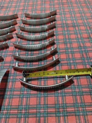 17 Tiradores de puerta curvos de acero inoxidable