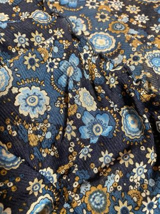 Top floral manga larga con lazada