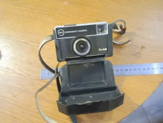 Antiche fotocamere. Ventilatore. Radio. Lenti