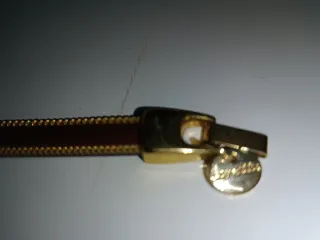 Pulsera Piel de Potro burdeos y Ribete Dorado