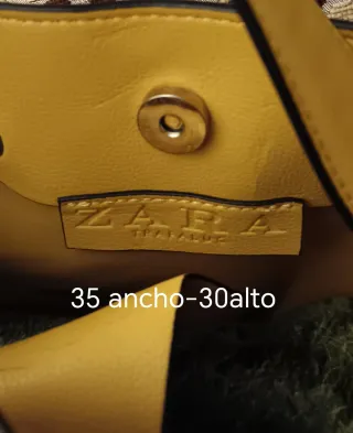 Bolso de piel con tachuelas