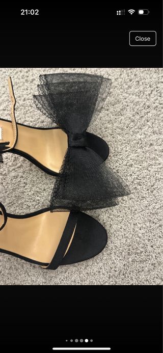 Tacones Jimmy Choo negros con lazo