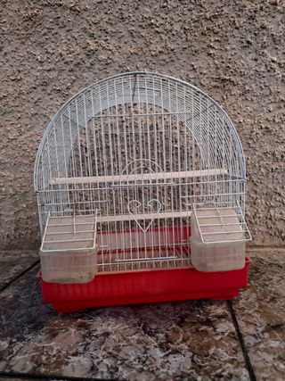 Jaula para pájaros con base roja