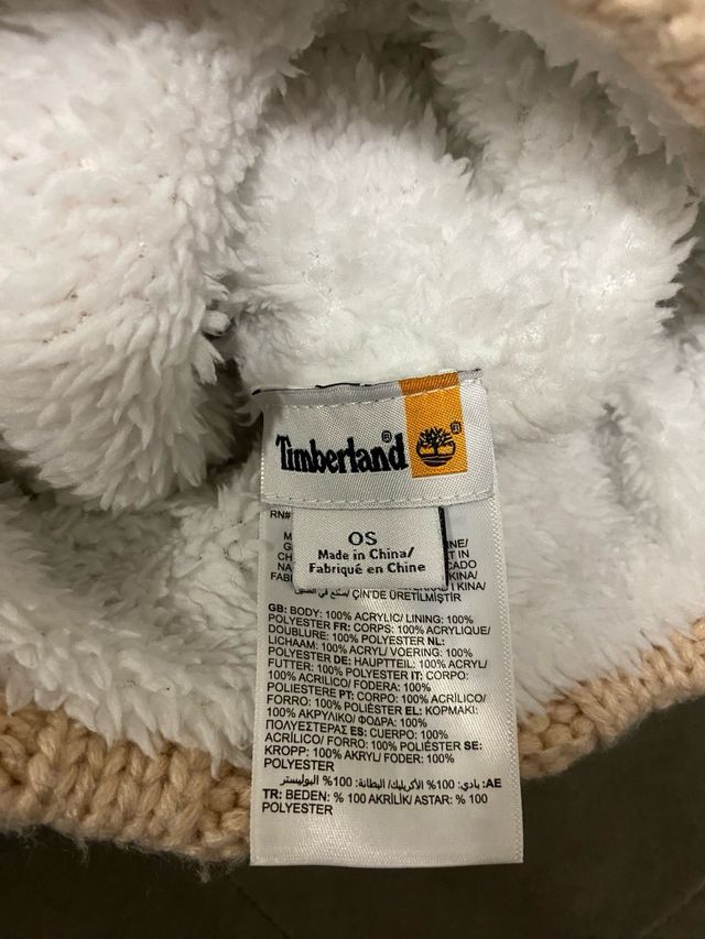 Berretto Timberland con pompon e trecce