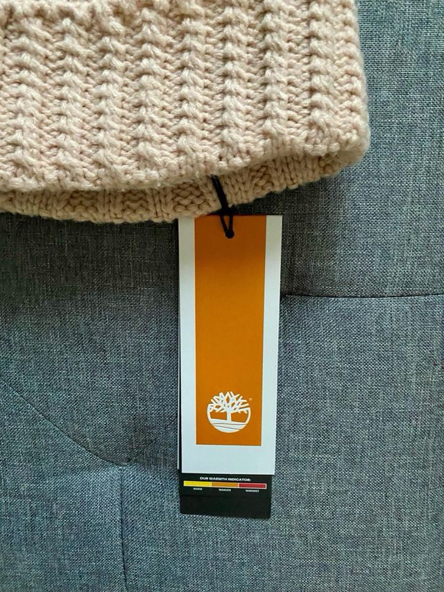 Berretto Timberland con pompon e trecce