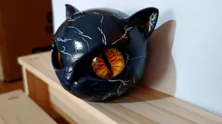 Testa gatto resina occhi gialli