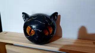 Testa gatto resina occhi gialli
