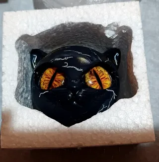 Testa gatto resina occhi gialli