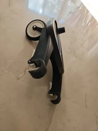 Adaptador universal para cochecito o carro