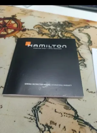 Tarjeta de garantía Hamilton y libro instrucciones