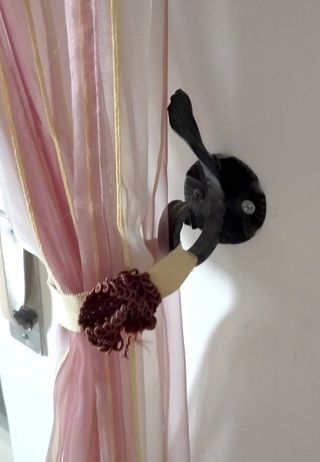 Coppia appendiabiti/fermatende ferro battuto