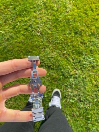 Reloj Bimbond plateado con esfera azul